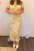This dress is gorgeous on and is a staple piece for any bride not wanting to stick with the typical white. The beading is a lot and can be heavy/overstimulating, but it's so worth it. Size up if you're curvy and big chested. - Haleigh A.