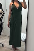 The fit of the dress is amazing. It is a true Medium for my body type (140lbs at 5'6 rectangle body shape with a B-C cup). The color however, was very different from the photo. It is a forest green but looks lovely on with right shoes and hair style. The wrap part is nice but if only tied on the one side it does tend to drape downward. Slightly tighter around the neck area than I would like but good for nothing to fall out! - Kailyn A.