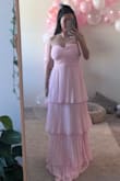 The dress is very flattering and true to size. If you are shorter (I'm 5'1"), you'll definitely need to get it tailored, but the sizing everywhere else fits perfectly. - Lisa B.