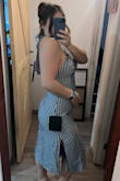 Purchased this for a work event in Miami. Really nice material where it's dressy but not too much (cocktail event). Straps around the neck flow very nicely down the back. My only issue was with the zipper; once it gets to the seams on the back, it gets stuck a little, and you have to really work it. I'm exchanging for one size larger (XL) because the stomach area is just a little too snug. - Destiny H.