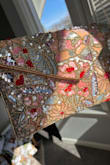I love the shades of pink and the gold chain on this purse. - Torrian P.