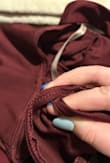 My dress looks great, but in the back seam the stitching caught another part of the dress. I now have to do work on the dress to fix this problem. It makes the back near the butt bunched up and not smooth. Also since it was snagged the outside shows a run and doesn't look very good. - Elizabeth A.