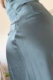 The lining is showing, and the fabric is bunching/uneven on the backside. - Arika K.