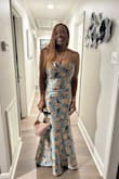 This gown was an absolute hit for the Mardi Gras Ball in New Orleans. I go every year and always buy my dresses from Lulus. I got so many compliments on this gown. My husband loved it and the price. It runs a little small in the breast. I bought a large and had it altered. - Tanya B.