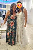 This review is long overdue! The dress is wonderfully made, excellent quality. Love the material, and the fact that it's lined makes the dress drape beautifully. I'm on the shorter side, so it was quite long on me. Even with 3" heels, the dress dragged quite a bit, so I would lift my dress when I walked to avoid accidentally tripping over it. The dress is a true wrap dress, so expect a deep plunge at the chest. I did have to use a safety pin to make sure I wasn't too exposed. Received many compliments and would definitely recommend! - Mona L.