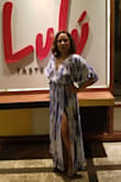 This dress is beautiful wish it came in petite sizes. I took it to the taylor to have it cut shorter and to move the front slit higher. It comes lined up to the cut in the front.  It has snap closure on the bust, but since I wore with no bra I put double sided tape.  Over all a great dress and fabric is the best already washed once and it still looks brand new. - Claudia P.