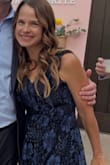 Many reviews note the deep "V" neckline. I took the dress to a tailor, and she was able to use the extra lace from inside the dress to partially cover the opening so it wasn't so deep. I wore the dress to a family wedding, so the deep neckline wouldn't have been appropriate. - Jennifer C.