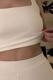 This outfit is really cute, but I'm disappointed in the quality of the top. There was too much extra fabric in the top that made it fold over. Otherwise, it fits great. I wanted to re-order another size M to see if it was just a fluke, but it's out of stock. - Laura C.