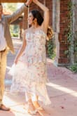 It fits a little loose on the top, but it's a beautiful dress. Flowy and fun. I received many compliments! - Denisse H.