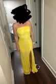 I immediately put this dress on and fell in love with it! The yellow color is so vibrant and beautiful. It's very flattering on my body. The slit was definitely high so I will end up getting that altered. I'm 5'2 so the dress was long even with heels so I'll get that hemmed. But otherwise it was beautiful!! - Surrey S.