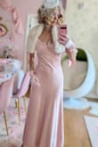 I was really surprised at the high quality of this dress. The fabric feels very luxurious and soft, and I really love the soft blush pink. It has a built-in layer underneath, but I would still recommend wearing a slip underneath. It fits me perfectly in the waist, but the bust was a little big, so I had to tweak it a little, or else the shoulder straps would slide off. Really happy with my purchase, and I would really recommend this lovely dress. - Heidi K.