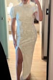 This dress is stunning. Fits great with plenty of give (if needed). I have a smaller bust, so that was the only part of the dress that could have fit tighter. I wore this to go wedding dress shopping and felt amazing. I got compliments all day! - Delaney S.
