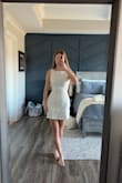 I bought this dress for my graduation, and I absolutely love it! The dress is stretchy but holds its shape super well! The fabric is a bit thicker, but I do not mind! Would 100% recommend if you have issues finding dresses that fit over your hips but flatter your waist. - Addy W.