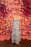 I bought this in size M for a "Garden Gala" at the Arboretum. Fit my body perfectly. I did have to get the hem adjusted as it covered my shoes. I think it's much prettier at this length. - Ada R.