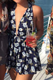 i love this romper and it's perfect for so many fun occasions! my only complaint is the material isn't very thick so it slides around a little bit depending how it is tied, and can be annoying to get on and off when out for a long time. but overall, super cute! - Hayley B.