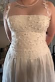 This dress is so cute, definitely worth the cheaper price tag. I took a gamble (since there were no previous reviews) and I am so happy I did. It's a little snug/has no stretch, is longer than I expected by about 3 inches, and the zippy is a little cheap. But I would still give this 5/5 stars easily. I'm about to be such a cute bride on our elopement! - Kaytee D.