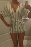 Really cute romper, but I wish it were just a couple inches longer. Feels like my booty is hanging out and it's just a tad see through. - Stacey A.