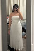It fit perfectly!!! I was scared that because it is a strapless dress, I wouldn't feel secure, but it fit great, and it feels very secure. It is not see through. The details on the dress are also very beautiful. - Isabel C.