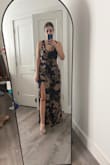 I am between sizes, and the medium is a little big on top, but I'm still planning to wear this to an upcoming black tie optional wedding. Love the hints of gold in the fabric! I am slightly concerned that it might be a litttttle see through, but I haven't really noticed an issue. - Therese B.