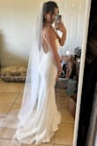 I was hesitant about ordering this dress because I did not think the quality would be good for the price, but I was pleasantly surprised! This dress fits me like a glove, and I loovvvee the lace detailing on the sides. I think the low back gives an elegant yet sexy vibe. Ultimately, I picked this dress for my elopement ceremony. It's so comfy, and amazing quality for the price. If I could make any suggestions, it would be to find a way to make the straps a little more elegant. I think the adjustable bra strap looks that the dress has kind of makes it look a little cheap. But overall I'm very satisfied!! - Julianna N.