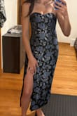 This dress worked out great for me as a wedding guest, and I got several compliments! I was able to adjust the tightness of the top using the tie that sat at about the upper back, so it didn't slip down or anything. My critique would be that the fabric is very stiff and didn't offer a ton of shape for my body, and because the fabric was so stiff, it was very hard to tie a cute bow in the back. Required some workaround with body tape to get shape/support. - Taylor P.