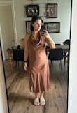 I'm returning this dress, but the pros are that the color is pretty even, though I didn't think it looked great on my skin tone. The fabric is thick so it feels worth the cost. The cons for me are the awkward length, the slit being too high for a family event, and the overall ill fit for my body type. I'm curvy, so wearing this shape makes my waist disappear; I looked like a rectangle since I have wide hips. The back was loose, so it would show a bra. When I tied the neck tighter to help the back, the side zipper ended up on the front. I think if you're over 5'6 and filled the dress in well, it would be flattering. I got a medium, and maybe size small would have been better for me, but I still think the slit was too high for the wedding I'm attending, and the color did me no favors. I'm 5'4-5'5, 138 lbs, and wear size 36C bra. - Mallory I.
