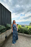 I recently wore this dress to a wedding in Colombia and loved it! I loved how lightweight the material was, as it was very breathable for the hot climate. Because of the pattern, it traveled really well and hid the few wrinkles it had; I didn't have to steam it! There was a bit of extra fabric in the bust area but not noticeable! - Michelle B.