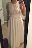 Love this dress!! I just got it for my bridal shower and it fits perfectly. The material is high quality - you can't tell from the photo, but there are actually 3 layers of material! The only downside is that the dress is very long on me so I have to get it hemmed. I am pretty average height (5'6") so I would assume this would be the case for most people. But aside from that, love the dress and would definitely recommend! - Natalie A.