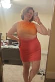 Drawn to the colors resembling the lesbian flag! It is on the shorter side for me, and it is only ruched on one side, which means I'm playing with it a lot to get it to lay well. But it will do well for Pride! - Devon K.