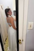 It is a stunning dress! I got it for my rehearsal dinner. I ordered a size small and had to take it to be altered. The waist down fits perfectly. I'm not sure if it is because of my height and it is made for a longer torso, or if it is because I did not fill out the chest (or both), but it was extremely large at the top. There is no way I could have worn it without alterations. You can see in the photo how much it had to be taken in. - Hannah R.