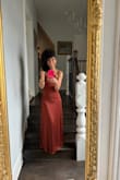 This dress arrived in two days versus the four days that I was expecting. All of the straps in the back really allowed me to tailor the dress to my petite frame. I got the XS, and the only alterations I had to make were for the length, and I got cups sewn in for the bust, given my Petit frame. - Tiffany L.