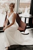 This dress fit absolutely perfectly right off the hanger, except for length. We got married at the courthouse and hired a photographer for a special day, and the dress was absolutely perfect. The lace is such a beautiful touch while keeping the dress simple. It fit perfectly in all the right places. Did not have any issues with snags or stains.  Wrinkles came out easily. The dress was flawless all night. - Nicole R.