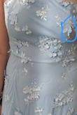 Overall, this dress is quite pretty, and the flower appliqué design is thick, but it is on a sheer/mesh fabric, which makes it not feel so heavy on the body. I think this would work for a summer event, but it does seem to run slightly smaller than true to size. There was also a flower at the breast area that stuck straight out and would not have looked flattering in photos. Ultimately, I found another dress I liked more, so I returned this one. - Katie P.