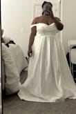 Beautiful dress! But ended up being too big. I reordered a 1x and even that one was still a little big, but not as much. I'm 5'2, the dress is very long - Kasey L.