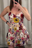 This is so pretty! I ordered it for my birthday tea party. There is no stretch but it fits true to size. - Kasey A.