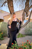 I purchased this dress for my engagement photoshoot. I was going for a morticia adams vibe and it was perfect! The material quality was outstanding. It didnt feel like a $90 dress; it felt like something I would have paid $500 for. It had a bit of stretch so i was able to move comfortably in it. The bodice was supportive but i did use a strapless bra to keep things where i wanted them. It is long though so make sure you account for that with your shoe choice. The hip measurements are super important because when i tried a size up there was a ton of extra material there. Zipper was a little sticky but not bad. I did wear some spanx to even out my tummy. I never thought i would feel comfortable and confident in a dress like this and i love it so much! Please note the sleeves were NOT something that came with the dress. I will be re-wearing it for my rehersal dinner:) - Holly H.