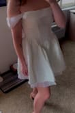 I ordered this dress for my tea party-themed bridal shower after eyeing it on the website for months, trying to find an excuse to buy it for one of the many bridal events. The dress pattern is beautiful, really detailed. There is some stretch to the material. Even though the sizing was a little large on me (not enough to size down), I did struggle with the zipper on one spot of the track, so just a heads up that zipping up can be a one person job, but is probably easier with a buddy since it's a side zipper. - Tara O.