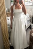 Beautiful and great quality! It's not very tight around the waist - so it doesn't do much for the figure. - Addison M.