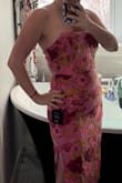 This dress did not disappoint. It's form-fitting but also sturdy fabric, so it's flattering and smoothing. The colors are bold and vibrant. Very well made and the little details in the design took in consideration for the female body. I'm usually a medium in pants and small in tops, but this was too small for me in medium. The large zips great but still a little snuggly in the waist. I'm ok with that as it holds me in all the right places! - Gina P.