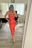 Flattering, confidence-boosting dress with a very sexy look. I usually avoid strapless styles because they tend to slip, but this one stays perfectly in place. The elastic is strong and secure. The mesh material has great stretch in all the right places and hugs your body nicely. The length is perfect. The description photo looked much paler in color, while the actual dress is a deeper orange and red. It is darker in person but still looks beautiful. Overall, I love this dress. - Haley B.