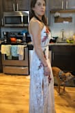 I don't have enough good things to say about this dress! I got the heels suggested in the listing and it all comes together perfectly! It may be about a half inch too long but nothing extraordinary for a long dress. I probably won't get it hemmed at all. I love that I can manipulate the space between the two pieces too, so that it can appear as one long dress or show some skin depending on when I wear it. - Laura B.