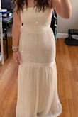 I got this for my rehearsal dinner for my August wedding! I'm in between medium and small sizes. Iwent with the small and glad I did! It's not too heavy and breathable. - Haylee B.
