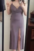 The fabric was light (great for warm weather, terrible for the cold), the color was a gorgeous pastel purple and it formed to my body very well (you WILL see the belly pouch). My only concern was the top portion that held my breasts. It was way too loose even with adjusting the straps to tighten them up a bit. It felt like my breasts were going to fly out at any given second. It was a very sexy dress, but it was just too revealing for a family wedding.
Major note: if you're going to use a sticky bra with this dress, make sure you hide it well otherwise it WILL show in this dress. Though, I had to return the bra I used because it dwindled away after just 2 hours. - Jade R.
