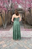 I absolutely loved this dress! It fit perfectly and felt amazing to wear. The fabric is silky and comfortable, and I had zero discomfort even after hours of moving and dancing. The quality is fantastic, and it looks so elegant. Shipping was incredibly fast, and I got so many compliments. I'll definitely be using this company again for future events! - Addilyn P.