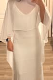 I needed a slip dress to go with this cape I bought, and I found this one on sale and thought it was perfect. It is more yellow ivory than other dresses I've tried, but it still looks great with the cape. It fits me great and is not see-through. - Mallorie W.