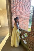 I felt like a cowgirl princess! Butter yellow is the perfect spring summer color. The bottom of the dress and the corset give it that princess feel. I love the slit up to the hip. I danced the night away without any incidentals. The built-in bra was a nice touch. Only thing that could have made it better was pockets, but otherwise this dress is one I'll keep in my closet for special events! Love love love! - Amber B.