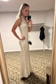 Great stretchy material. Good quality. Fit true to size. I wore spanx underneath just to make myself feel more comfortable in it. I got so many compliments! - Caitlin B.