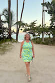 I purchased this to wear in the tropics for my 50th birthday bash. The dress was a little tighter across my back and chest than I expected, but I wore it anyways; it just fit more like a corset. If you are chesty or have a wide back, you may want to size up. - Keri S.