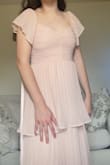 I love the look of this dress! It was a little closer to my skin color than I anticipated and the sleeves were a little loose, but that's the nice thing about the tie in the back, it makes the dress adjustable. Wearing it as a bridesmaid :) would recommend! It reminds me of the flowers God made. - Alyssa B.
