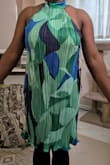 The dress seems like it should be one that flows with movement, but it fits more like a bodycon dress, which does not fit my body type at all. See how it fits in my provided photo. Immediate return. - Alena N.